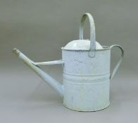 A vintage watering can. 43 cm high.