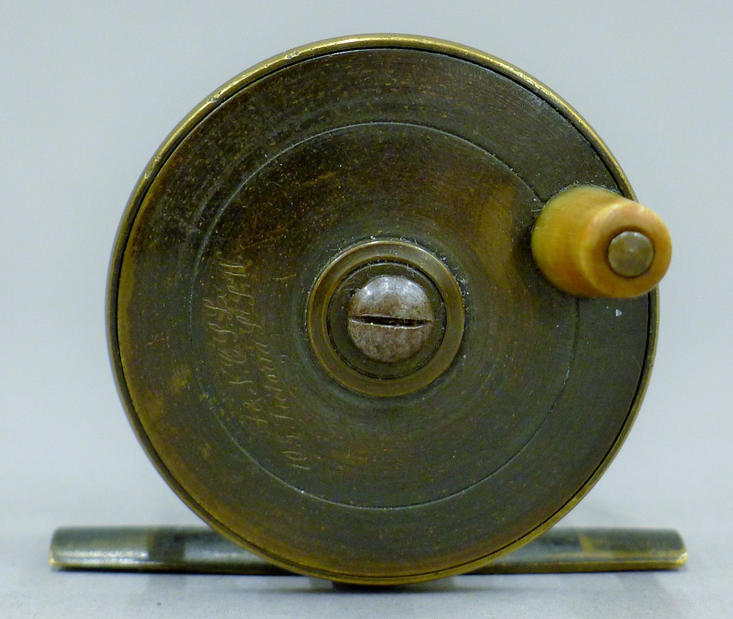 An Army and Navy 2 1/4" brass trout fly reel engraved "105 Victoria Street, SW". - Image 2 of 3