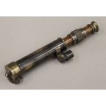 A small brass telescope. 23.5 cm long.