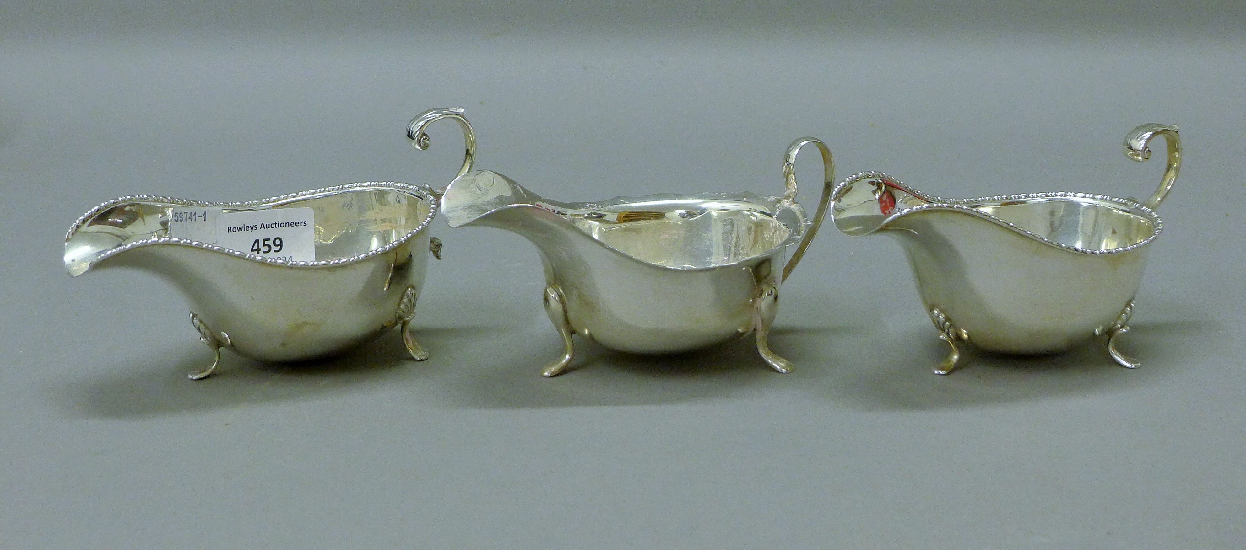Three silver sauce boats. The largest 14.5 cm long. 295.4 grammes.