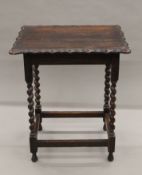 An early 20th century oak barley twist side table. 60 cm long.