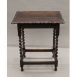 An early 20th century oak barley twist side table. 60 cm long.