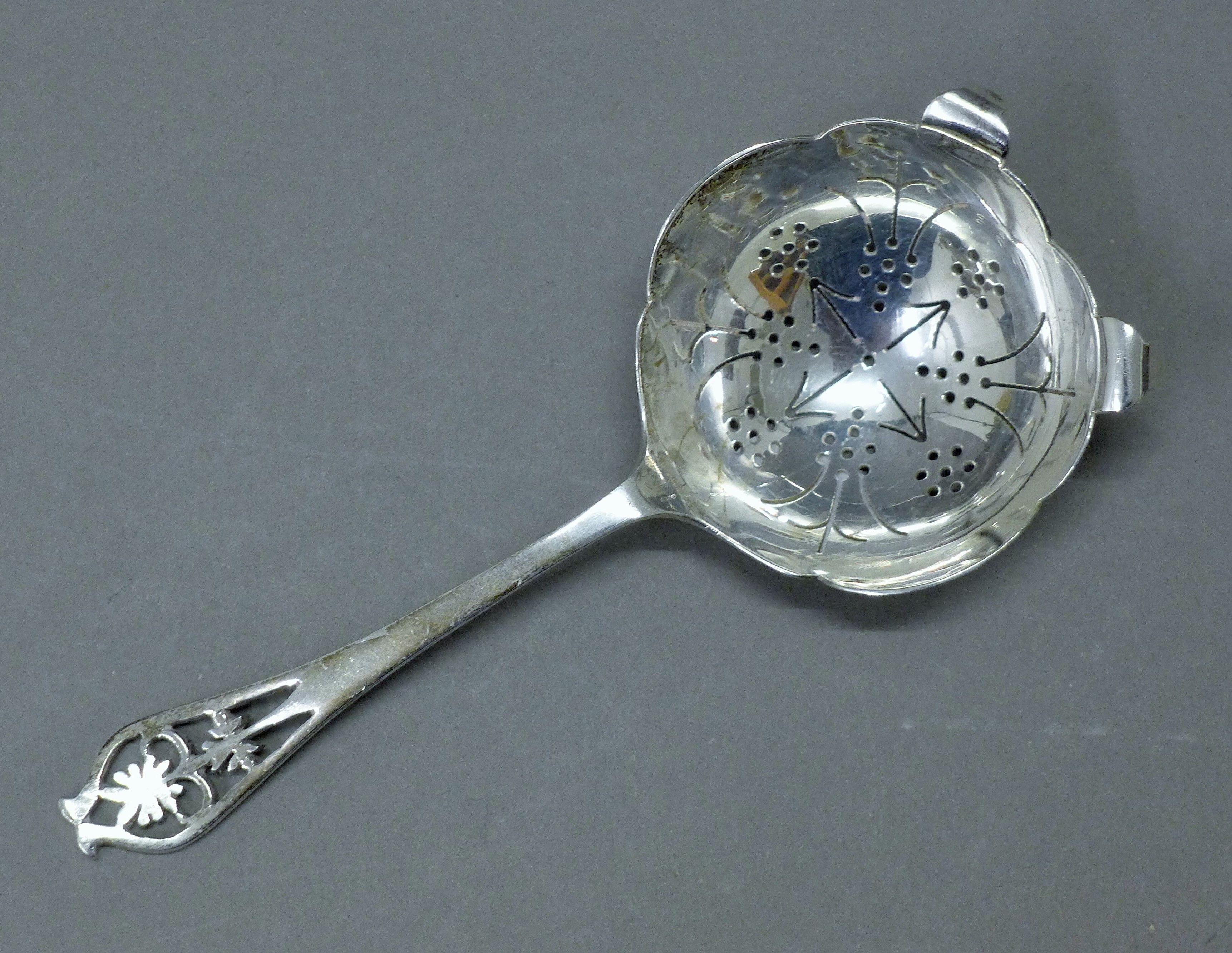 A silver serving fork and a silver sifter spoon. The former 24 cm long. 181.5 grammes. - Image 5 of 7
