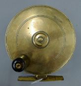 A circa 1890 Malloch's Brass sidecaster salmon reel. 10 cm diameter.