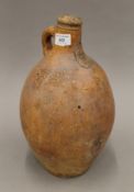 An antique masked Bellarmine jug. 35 cm high.