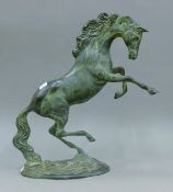 A bronze model of a rearing horse. 38 cm high.