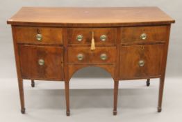 A 19th century line inlaid mahogany bow-front sideboard. 146 cm wide.