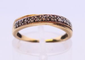 A 9 ct gold diamond ring. Ring size K.