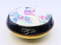 A round enamel trinket box. 6 cm diameter.