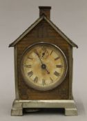 A late 19th/early 20th century alarm clock formed as a house, the dial inscribed Seth Thomas. 17.