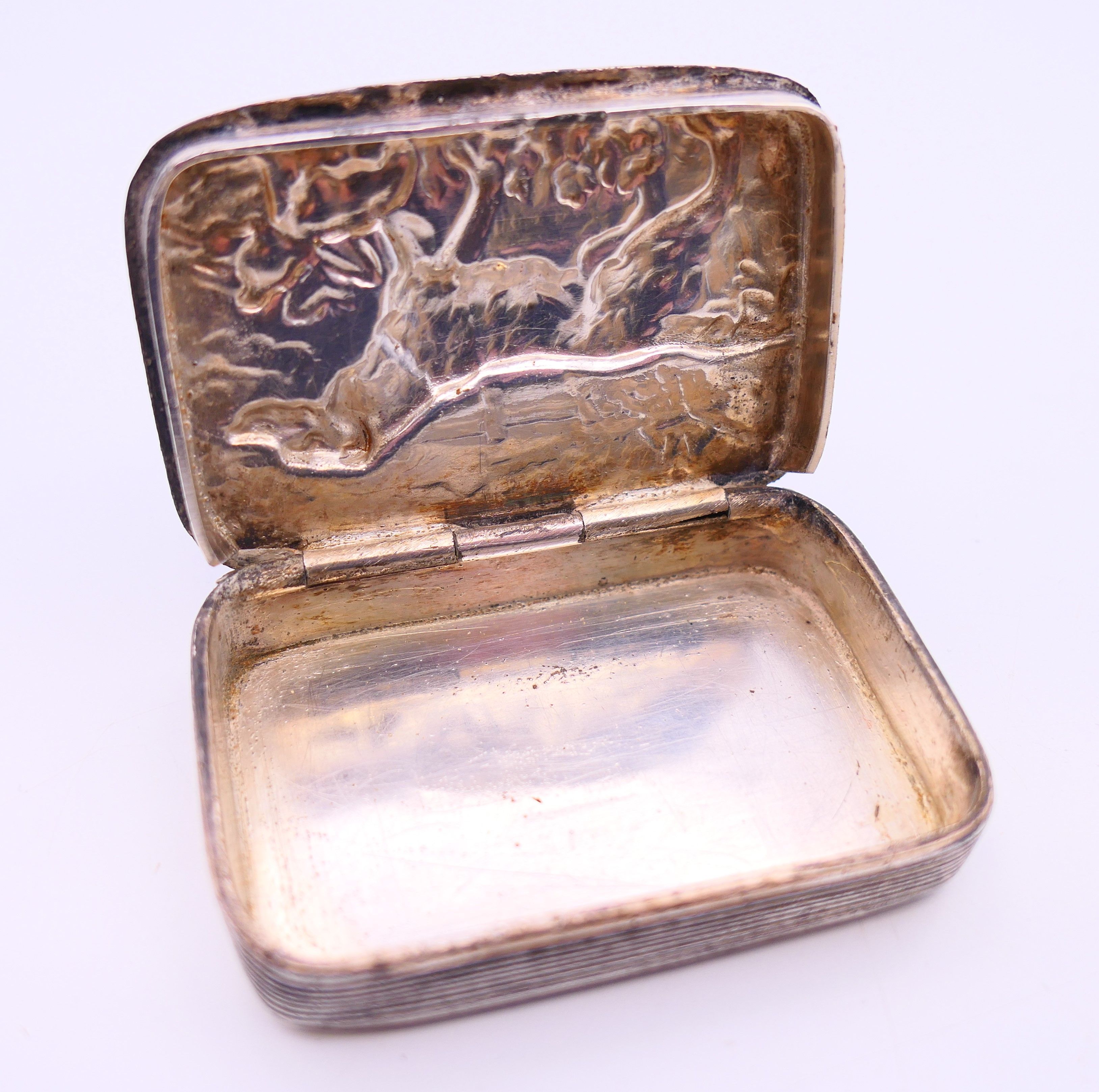 A Victorian silver plated snuff box embossed with a shooting scene with a flat coat retriever. 6. - Image 3 of 6