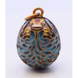 A silver and enamel egg pendant with Russian marks. 2.5 cm high.