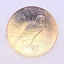 A 1924 silver one dollar 'Peace' coin together with a certificate of authenticity.