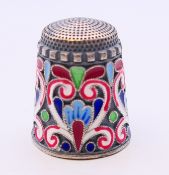 A silver and enamel thimble bearing Russian marks. 2.5 cm high.