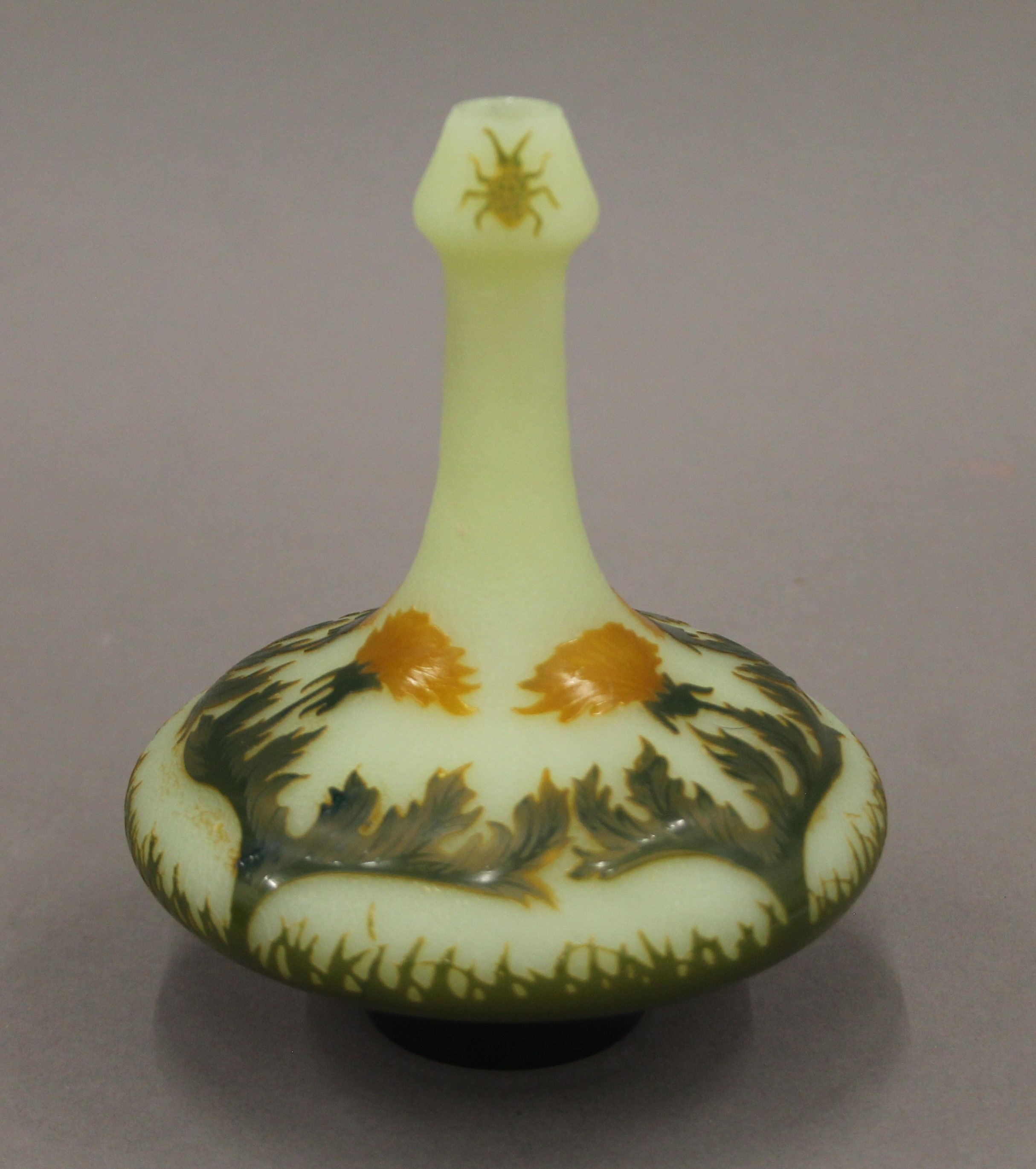 A French acid-etched cameo glass vase of squat shape, the bottle neck decorated with two beetles,