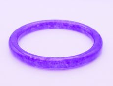 A lavender jade bangle. 6 cm internal diameter, external diameter is 7.5 cm.