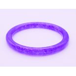 A lavender jade bangle. 6 cm internal diameter, external diameter is 7.5 cm.