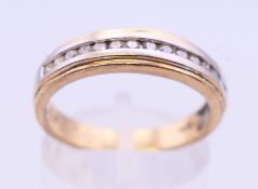 A 9 ct yellow and white gold diamond ring. Ring size P.