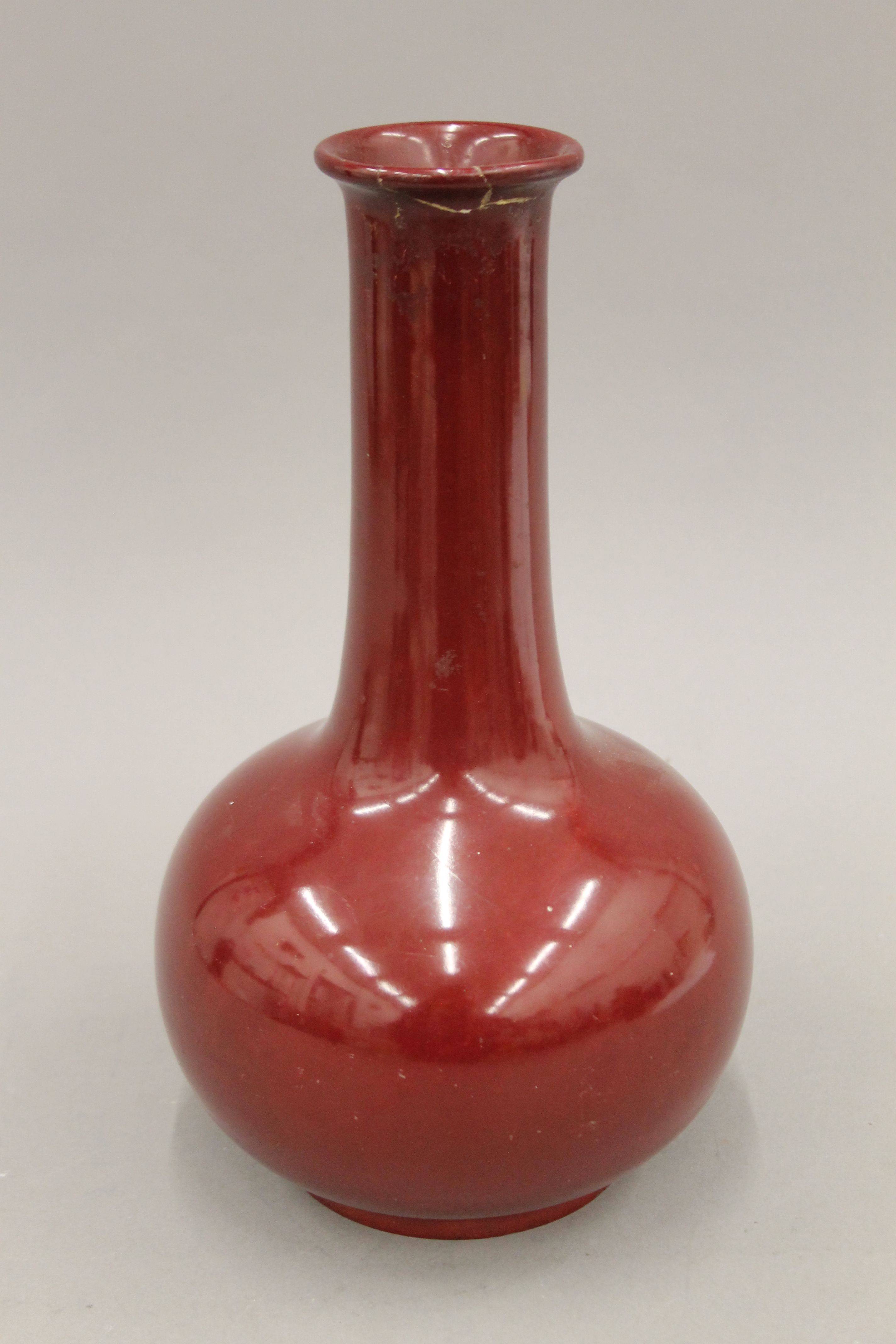 A Bernard Moore red glazed vase. 30 cm high.