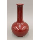 A Bernard Moore red glazed vase. 30 cm high.