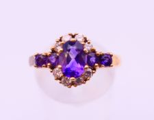 A 9 ct gold, diamond and amethyst ring. Ring size S.