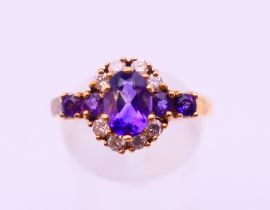 A 9 ct gold, diamond and amethyst ring. Ring size S.