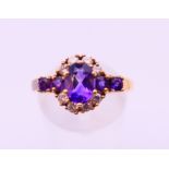 A 9 ct gold, diamond and amethyst ring. Ring size S.