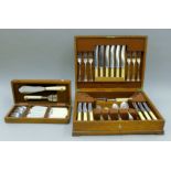 An oak-cased canteen of silver-plated cutlery and an oak case of plated fish cutlery.