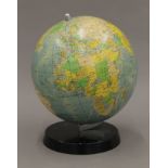 A vintage desktop globe. 26 cm high.