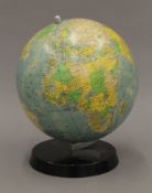 A vintage desktop globe. 26 cm high.