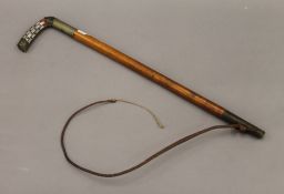 A riding whip with inlaid mother-of -pearl handle, inscribed 'LT W.T.CUMMINO A.O.C'.