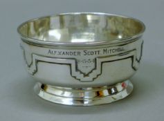 An Art Deco silver sugar bowl inscribed Alexander Scott Mitchell 8.6.34. 10 cm diameter.