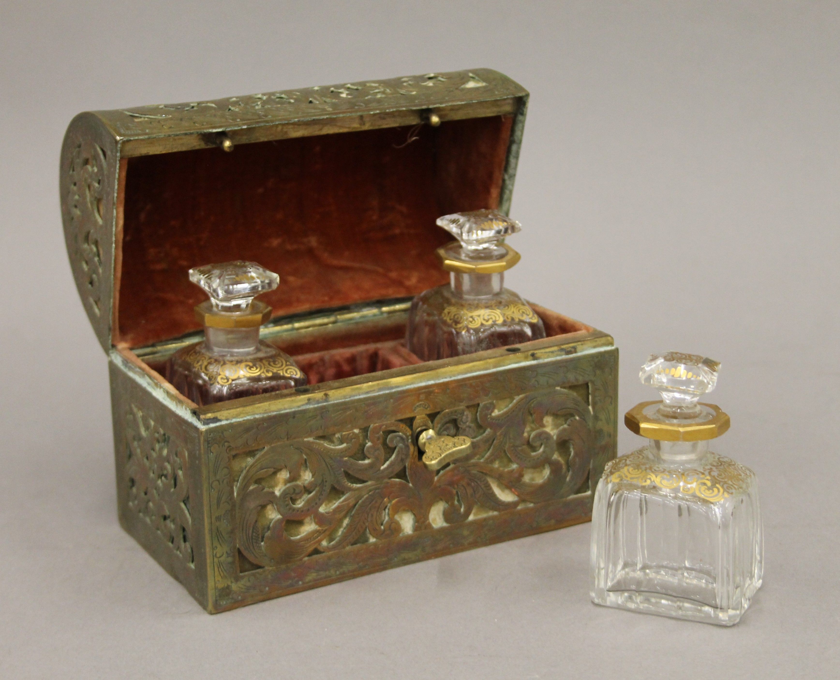 An antique dome-shaped pierced brass velvet-lined perfume casket containing three gilded cut glass - Image 5 of 6