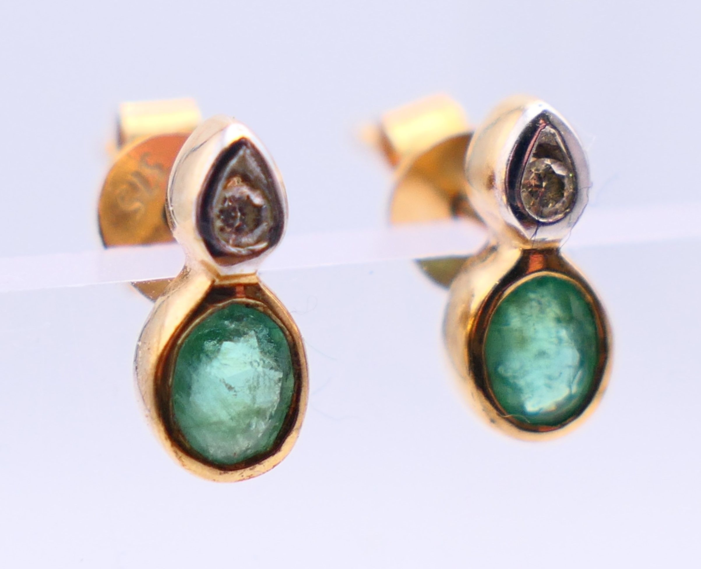 A pair of 9 ct gold earrings set with diamonds and emeralds. 0.75 cm high. - Image 2 of 4