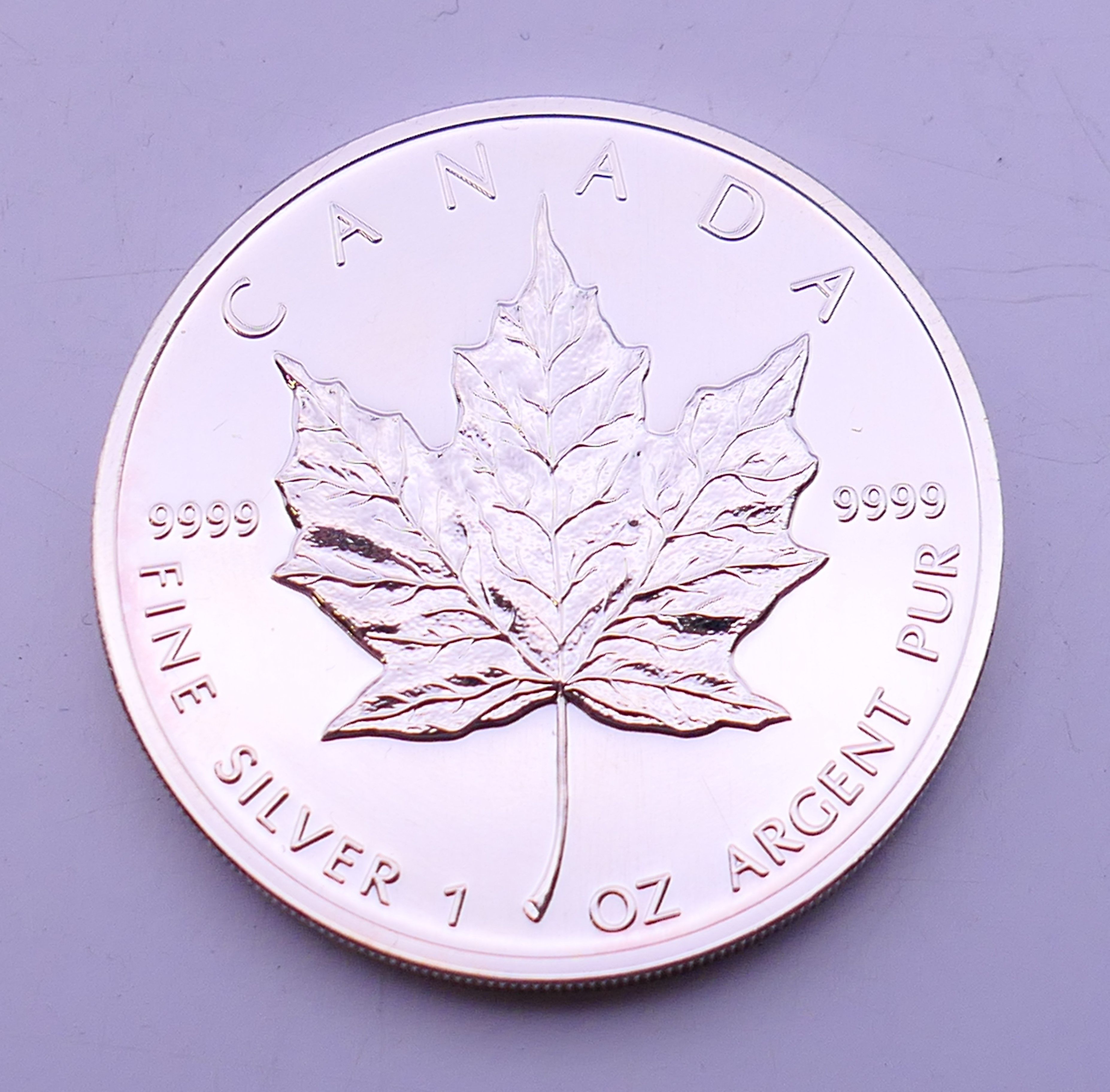 A 1998 Canadian fine silver one ounce 5 dollar maple leaf coin. - Image 3 of 4