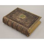 A Victorian brass-bound leather Bible. 32 cm high.