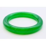 An apple green jade bangle. 6 cm internal diameter, external diameter is 8.5 cm.