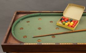 A Victorian mahogany folding bagatelle board with later balls. 57 cm wide x 244 cm long when open.