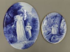 Two 19th century blue and white porcelain plaques. The largest 35 cm high.