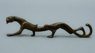 A bronze tiger scroll weight. 17.5 cm long.