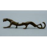 A bronze tiger scroll weight. 17.5 cm long.