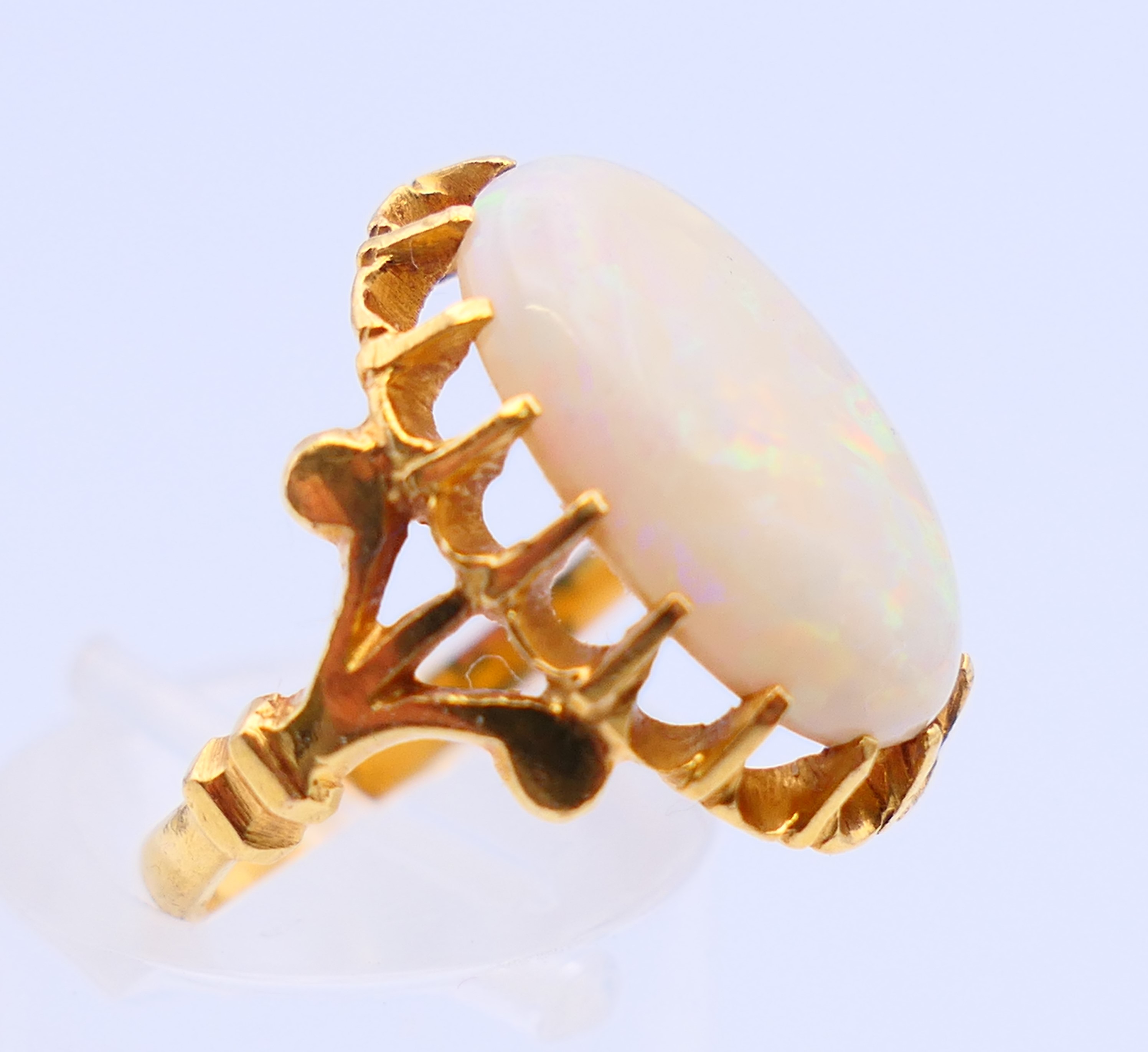 An unmarked 22 ct gold and opal ring. Ring size J. - Image 2 of 5