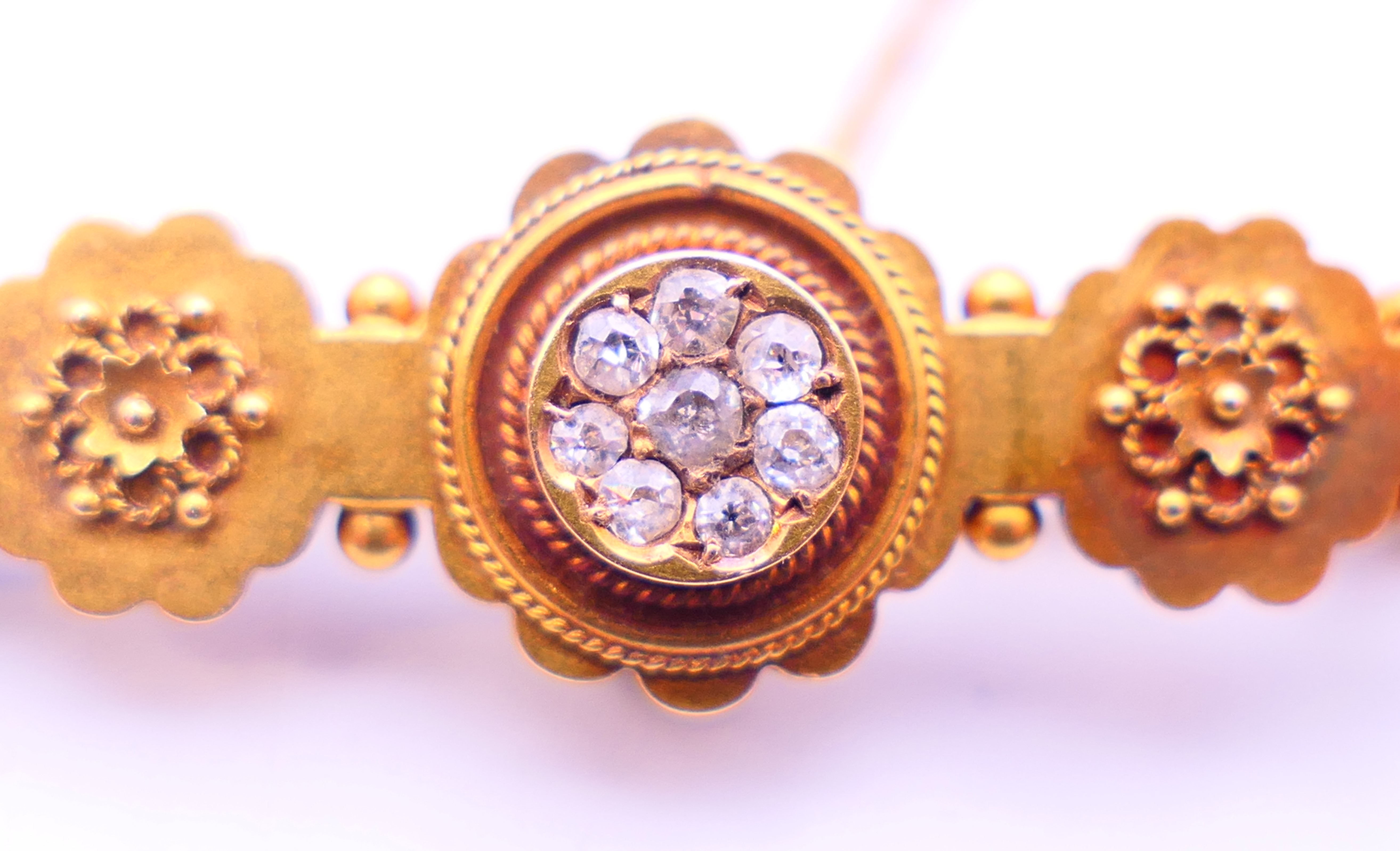 A 15 ct gold and diamond brooch. 4 cm long. 3 grammes total weight. - Image 2 of 5