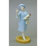 A Royal Doulton figurine, HM Queen Elizabeth The Queen Mother, HN4086.