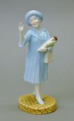 A Royal Doulton figurine, HM Queen Elizabeth The Queen Mother, HN4086.