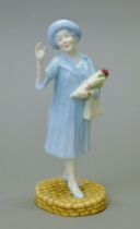 A Royal Doulton figurine, HM Queen Elizabeth The Queen Mother, HN4086.