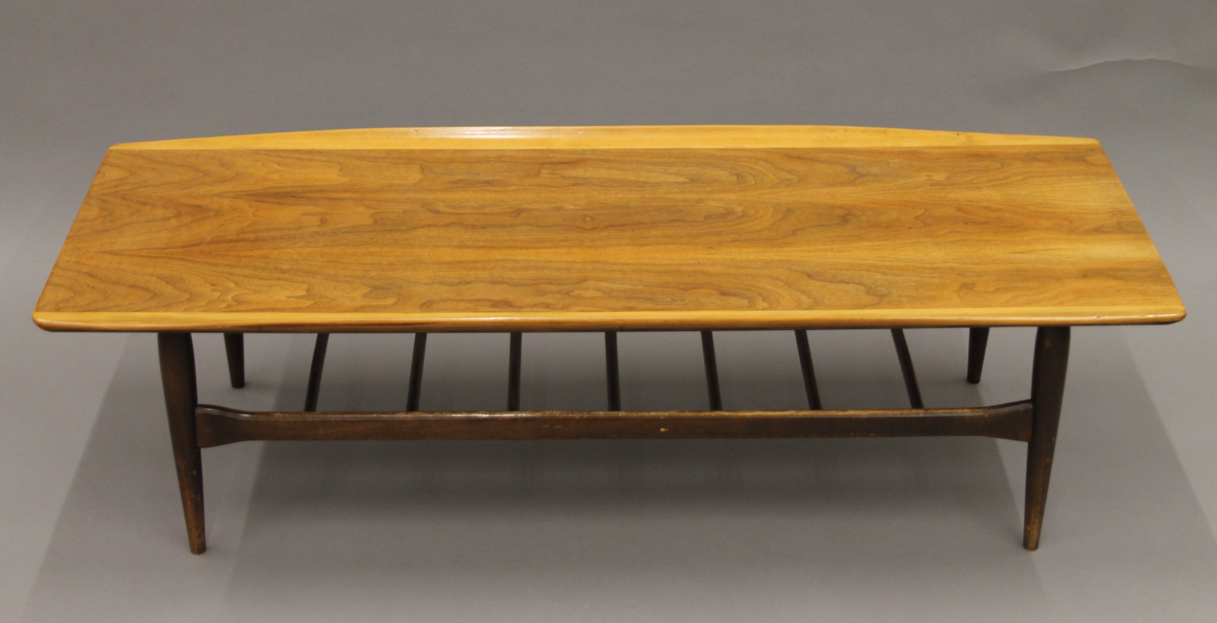 A mid-20th century coffee table. 135 cm long.