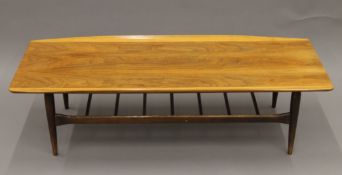 A mid-20th century coffee table. 135 cm long.