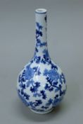 A Chinese porcelain blue and white straight neck vase. 30 cm high.