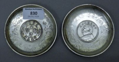 Two Chinese white metal coin dishes. 9 cm diameter.